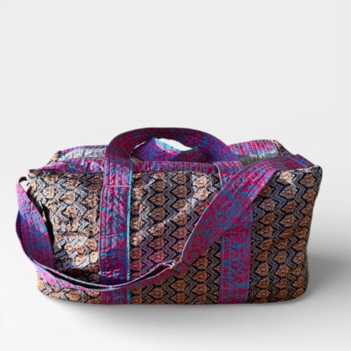 Unique weekend bag sewn from upcycled sari in Nepal